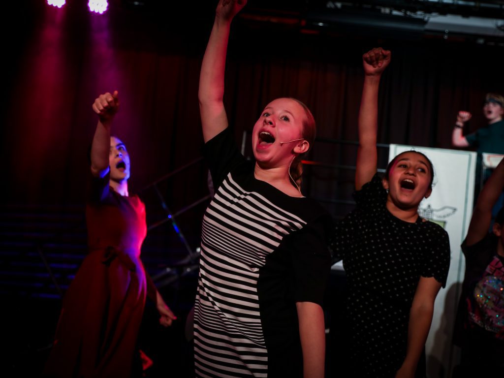People celebrating with raised fists