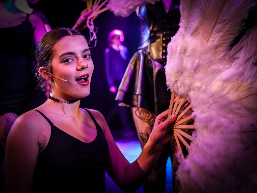 Performance with feathers and costumes.