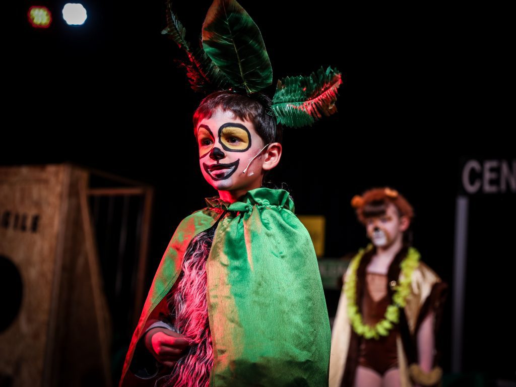 Child in costume on stage