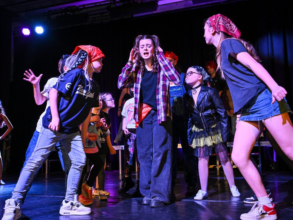 Children performing in a dramatic scene